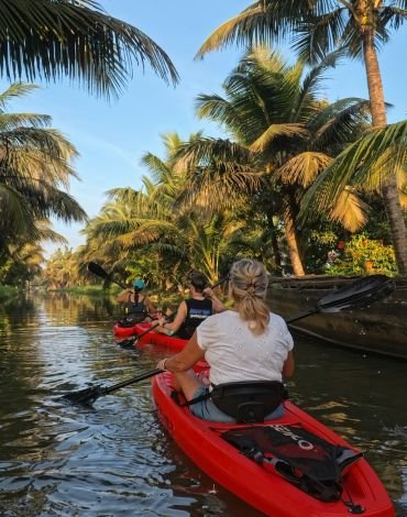 Village kayaking trip in Alappuzha backwaters at sunrise